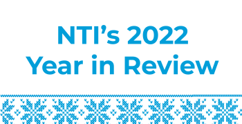 White background with blue snowflakes in an ugly sweater pattern with the blue text "NTI's 2022 Year in Review"